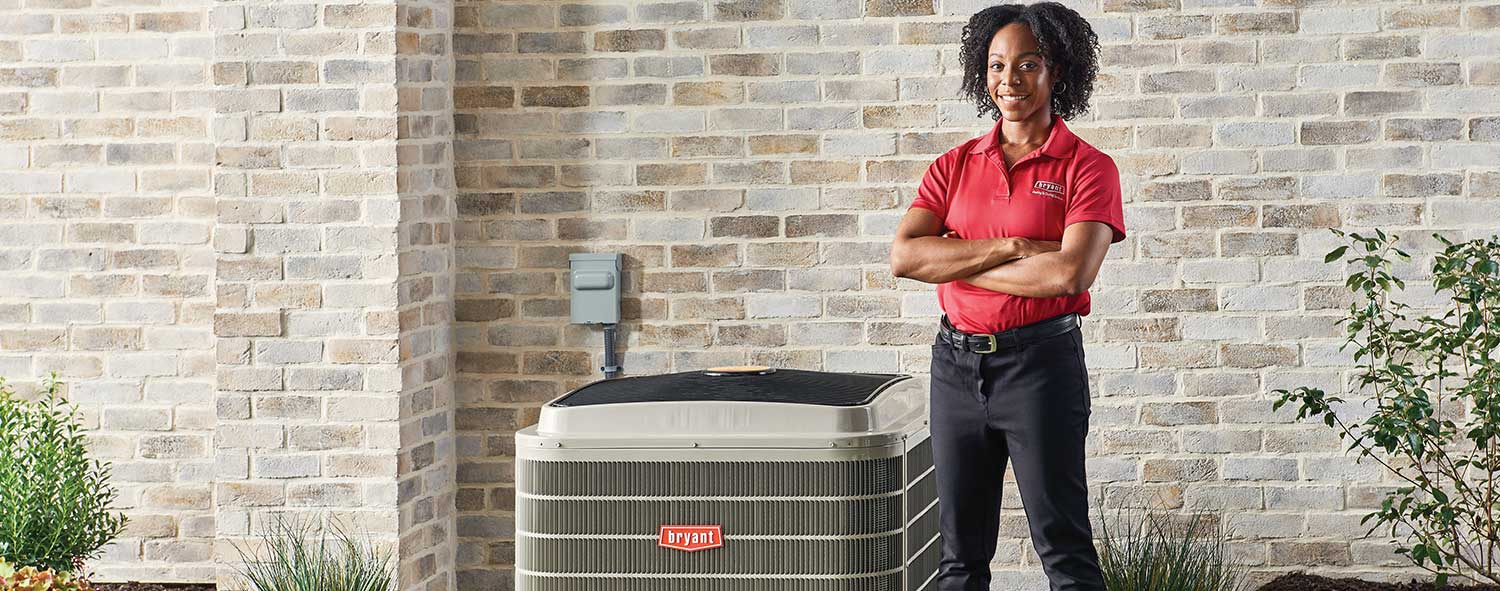 Bryant Tech standing by an a/c unit